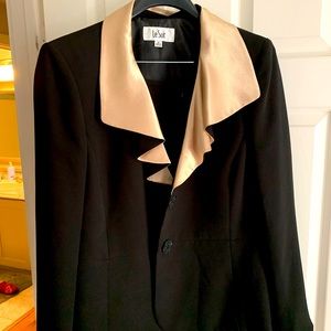 Woman’s suit jacket and skirt both silk lined.